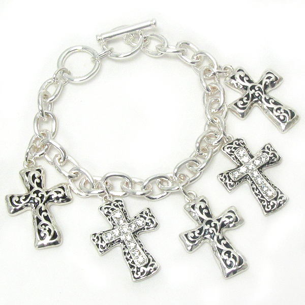 Crystal deco and metal filigree multi cross charm toggle bracelet