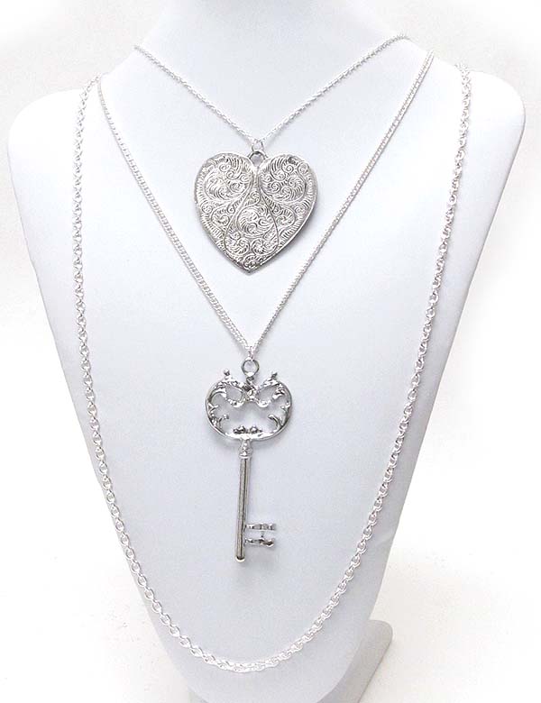 Metal filigree heart and key pendant double strand chain necklace