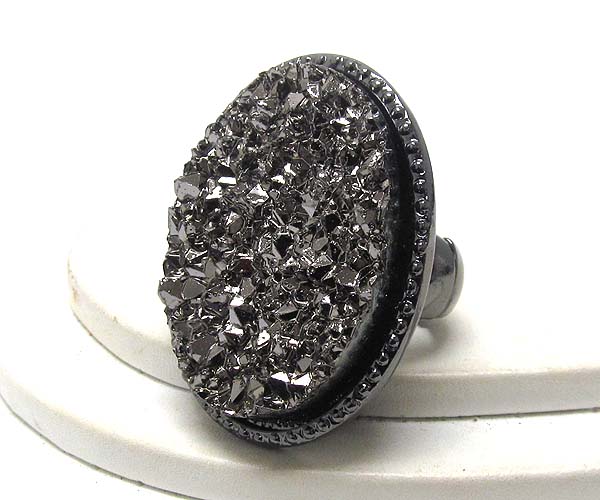 Textured metal with oval rough stone stretch ring