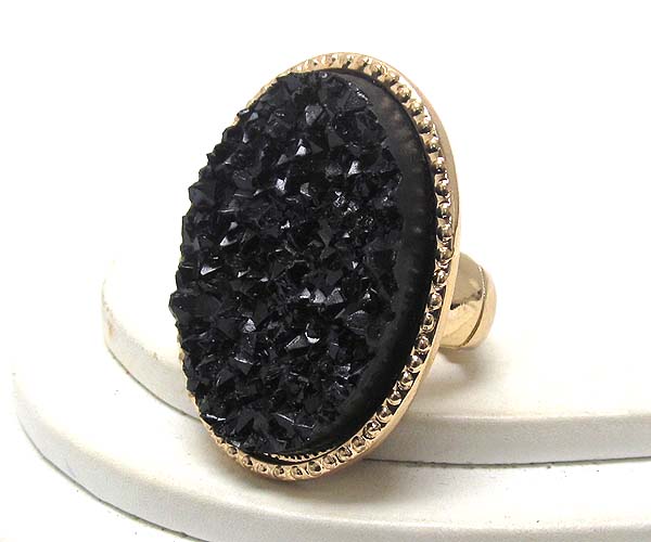 Textured metal with oval rough stone stretch ring