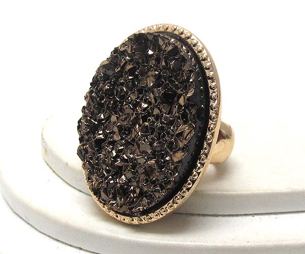 Textured metal with oval rough stone stretch ring