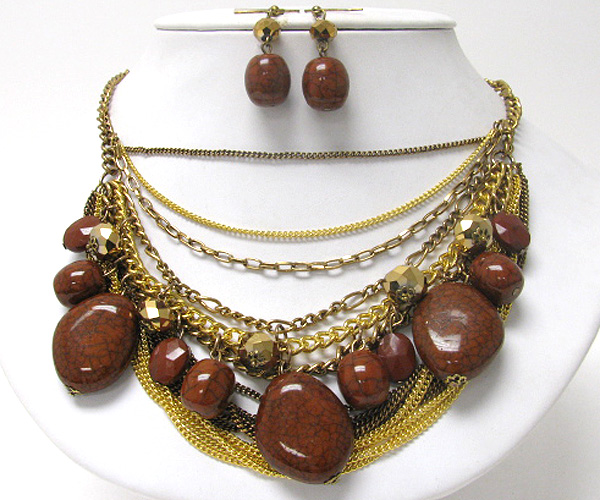 Multi figurine and glass bead drop and multi chain necklace earring set