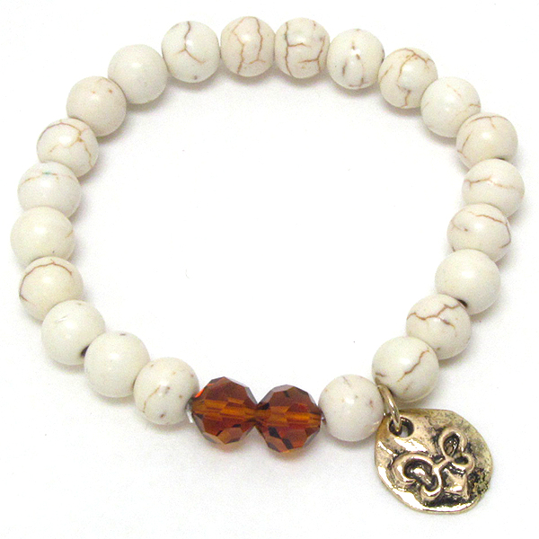 Fleur de lis charm and stone bead stretch bracelet