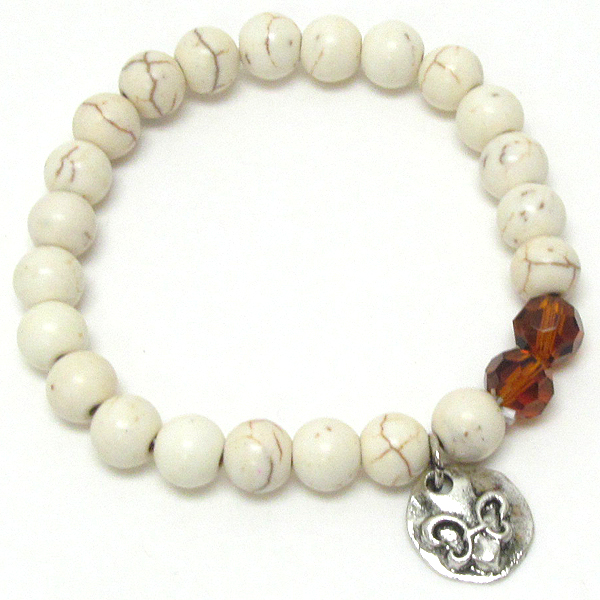 Fleur de lis charm and stone bead stretch bracelet