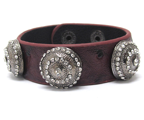 Three ctystal round textured metal with ostrich leatherette button bracelet