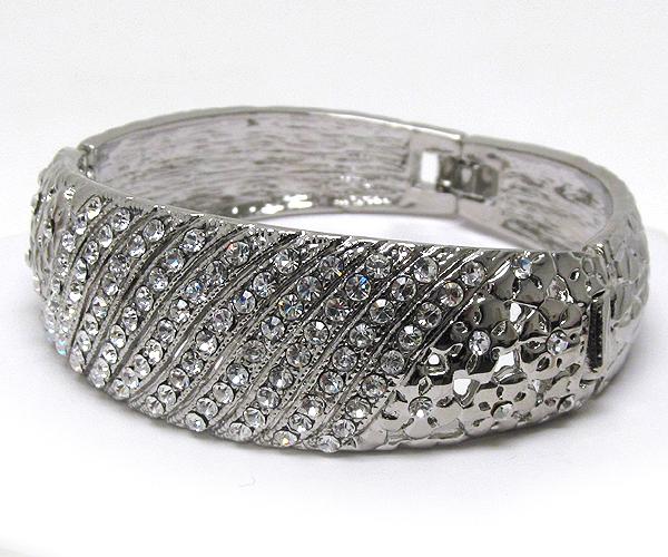 Multi line crystal with  textured metal flowers puffy clip hinge bangle