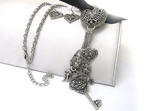 Ribbon tied antique filigree metal heart and key charm dangle long necklace earring set 