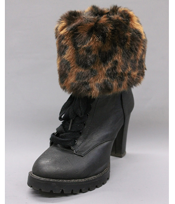 A pair of 100% polyester animal print fur boots topper