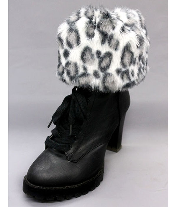 A pair of 100% polyester animal print fur boots topper