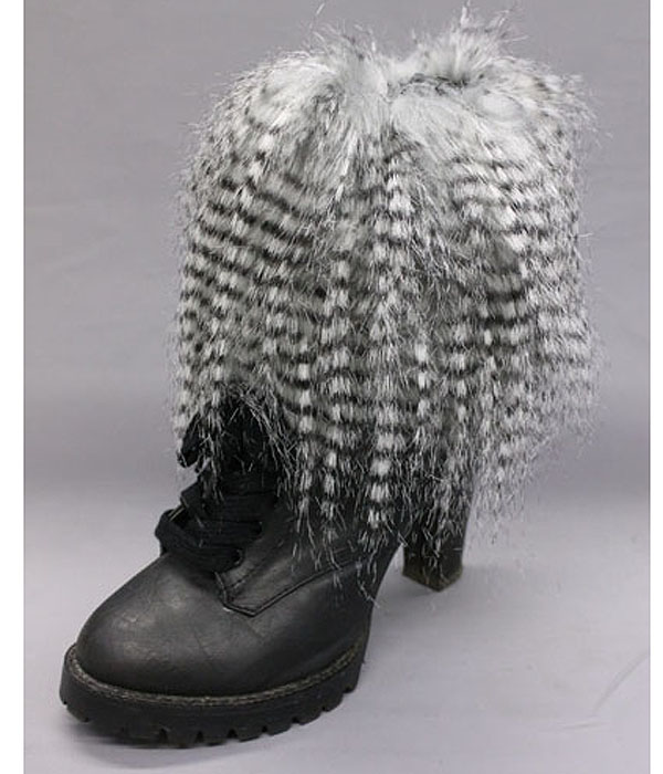 A pair of 100% polyester multi long fur boots topper