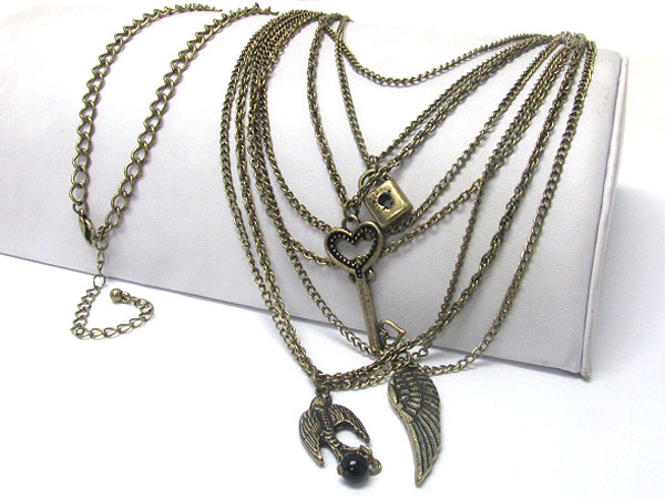 Bird wing and key and lock charm multi metal strand long chain necklace