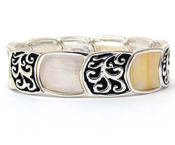 Metal round filigree and shell disk stretch bracelet 